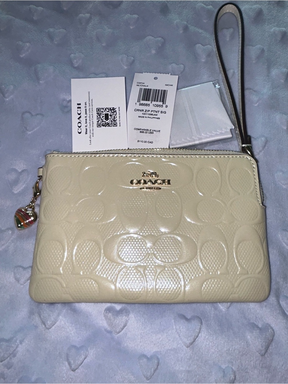 Coach Cream Embossed Signature Wristlet Clutch with Charm